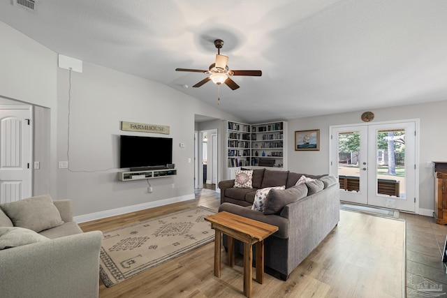 5613 Cane Syrup Cir, Pace, FL 32571 - living room featuring lofted ceiling, light wood-style floors, ceiling fan, french doors, and baseboards