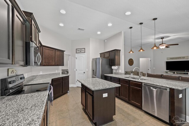 5613 Cane Syrup Cir, Pace, FL 32571 - kitchen featuring stainless steel appliances, a sink, open floor plan, a peninsula, and a kitchen island