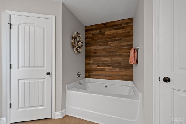 5613 Cane Syrup Cir, Pace, FL 32571 - full bathroom featuring wood walls, a bath, and tile patterned flooring