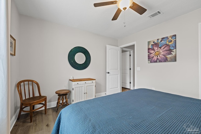5613 Cane Syrup Cir, Pace, FL 32571 - bedroom with wood finished floors, baseboards, and a ceiling fan