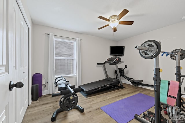 5613 Cane Syrup Cir, Pace, FL 32571 - workout room featuring ceiling fan, wood finished floors, and baseboards