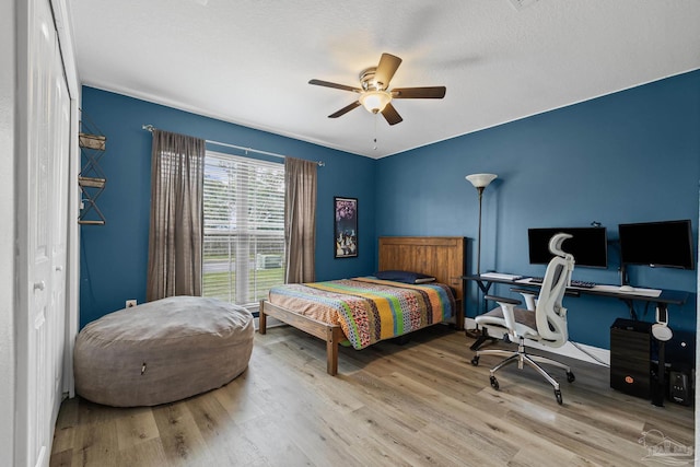 5613 Cane Syrup Cir, Pace, FL 32571 - bedroom with wood finished floors, an office area, and a ceiling fan
