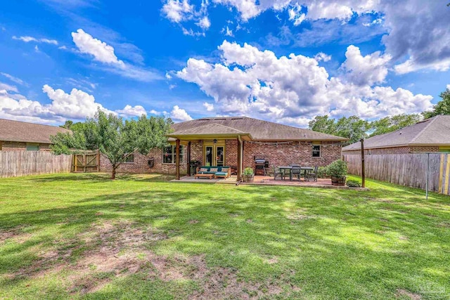 5613 Cane Syrup Cir, Pace, FL 32571 - rear view of property with a patio area, an outdoor living space, and brick siding