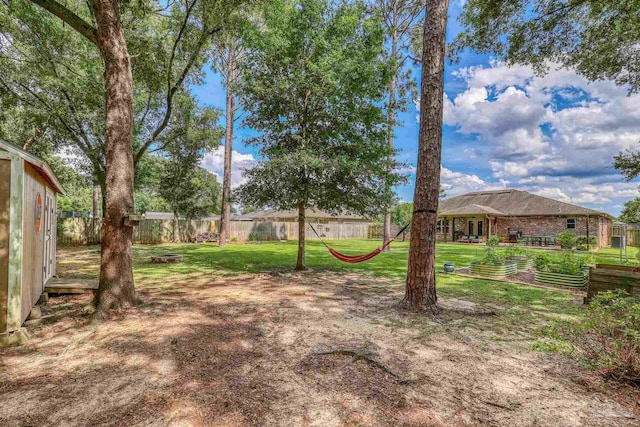 5613 Cane Syrup Cir, Pace, FL 32571 - view of yard featuring a garden