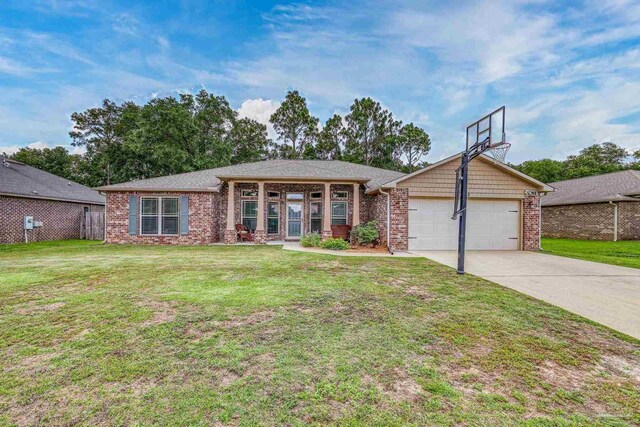 5613 Cane Syrup Cir, Pace, FL 32571 - view of front of home featuring a garage, driveway, and brick siding