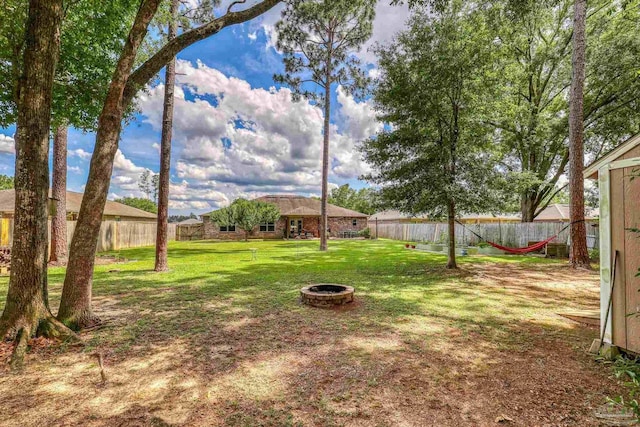 5613 Cane Syrup Cir, Pace, FL 32571 - view of yard featuring a fire pit