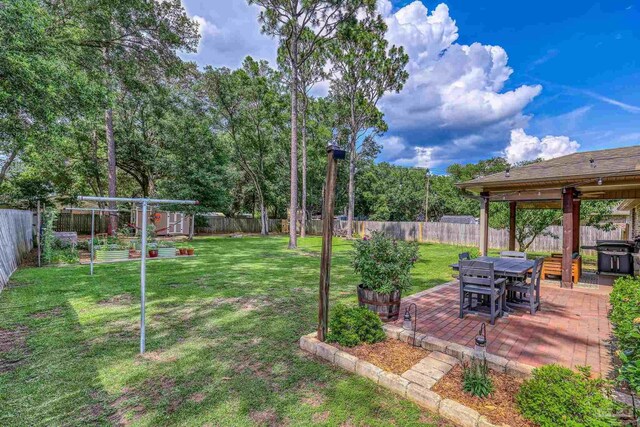 5613 Cane Syrup Cir, Pace, FL 32571 - view of yard with a patio area and a garden