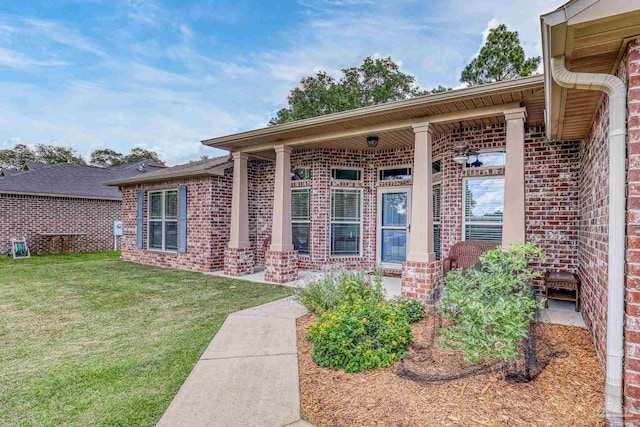 5613 Cane Syrup Cir, Pace, FL 32571 - doorway to property with brick siding and a yard