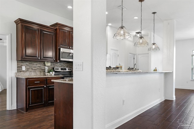 kitchen with pendant lighting, dark hardwood / wood-style flooring, tasteful backsplash, and appliances with stainless steel finishes