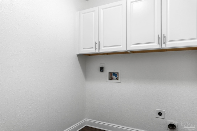 laundry area featuring cabinets, washer hookup, and electric dryer hookup