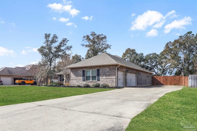 ranch-style home with a garage and a front yard