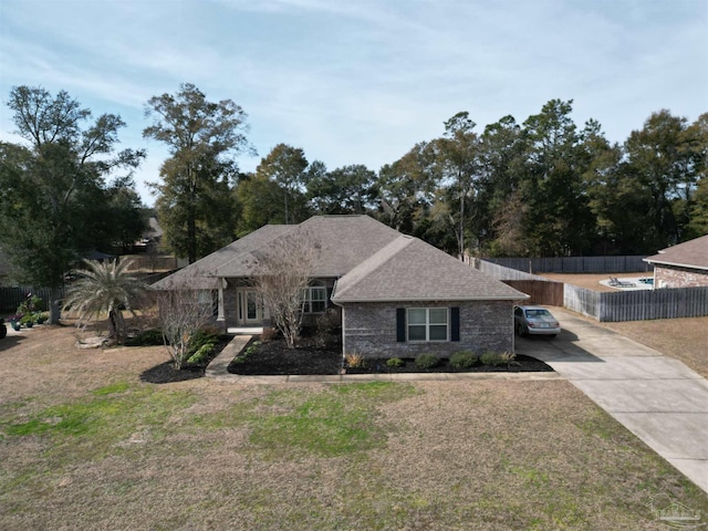 ranch-style home with a front lawn