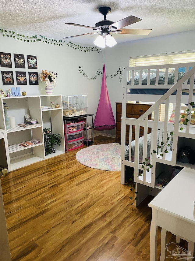 7453 Northpointe Blvd, Pensacola, FL 32514 - bedroom featuring wood finished floors and a textured ceiling