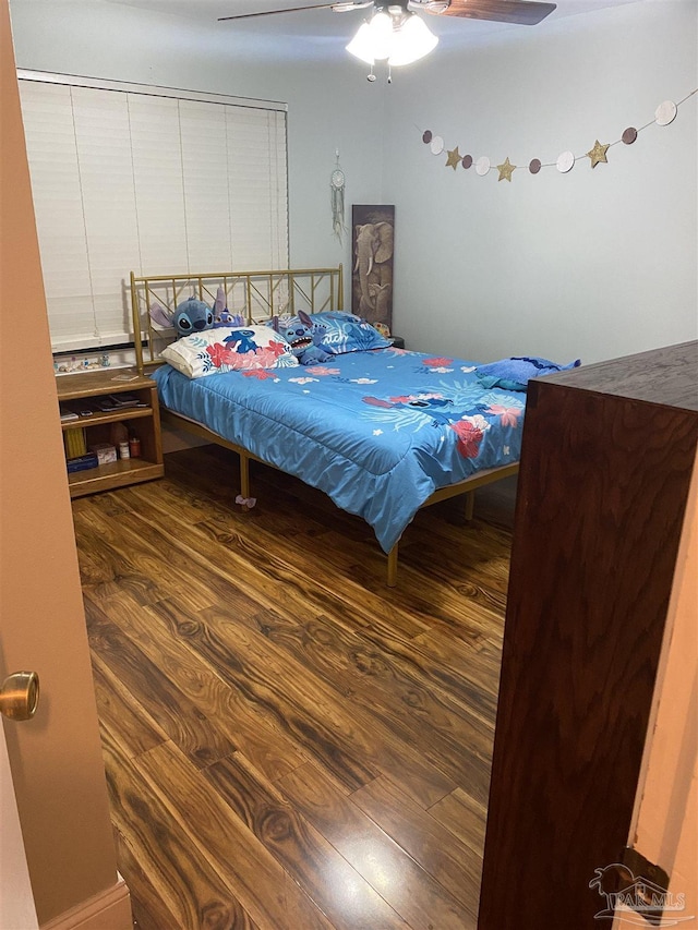 7453 Northpointe Blvd, Pensacola, FL 32514 - bedroom with wood finished floors and ceiling fan