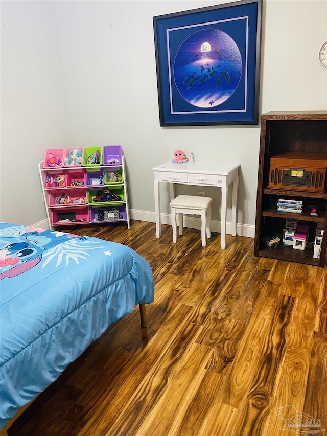 7453 Northpointe Blvd, Pensacola, FL 32514 - bedroom with wood finished floors and baseboards