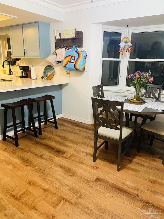 7453 Northpointe Blvd, Pensacola, FL 32514 - dining area with light wood finished floors and baseboards