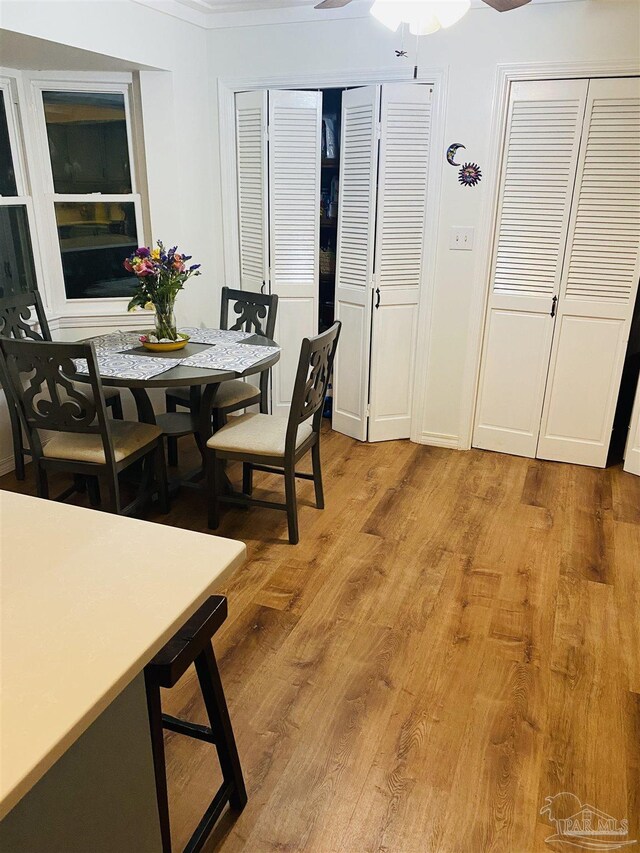 7453 Northpointe Blvd, Pensacola, FL 32514 - dining room featuring light wood finished floors and ceiling fan