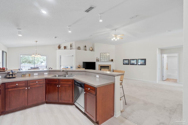 6742 Britt St, Navarre, FL 32566 - kitchen with a sink, stainless steel dishwasher, vaulted ceiling, a fireplace, and ceiling fan