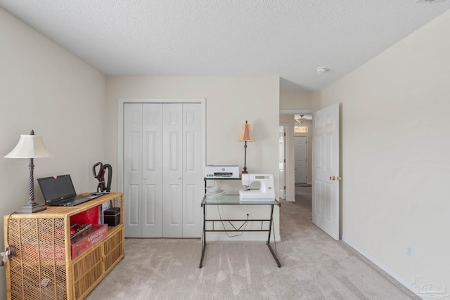 6742 Britt St, Navarre, FL 32566 - bedroom with carpet flooring, a closet, an office area, and a textured ceiling