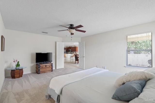 6742 Britt St, Navarre, FL 32566 - bedroom featuring light colored carpet, a textured ceiling, a ceiling fan, and baseboards