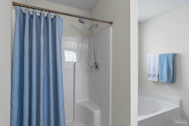 6742 Britt St, Navarre, FL 32566 - full bathroom featuring a textured ceiling, curtained shower, and a garden tub