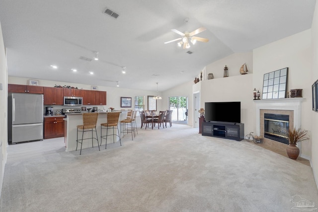 6742 Britt St, Navarre, FL 32566 - living room with ceiling fan, light carpet, a fireplace, and lofted ceiling