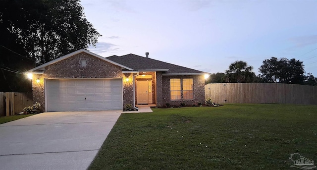 6742 Britt St, Navarre, FL 32566 - view of front of property with driveway, a garage, and brick siding