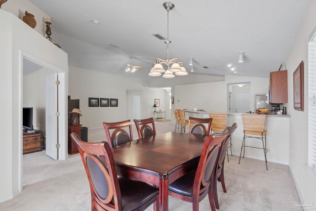 6742 Britt St, Navarre, FL 32566 - dining space featuring lofted ceiling, light carpet, a ceiling fan, a chandelier, and baseboards