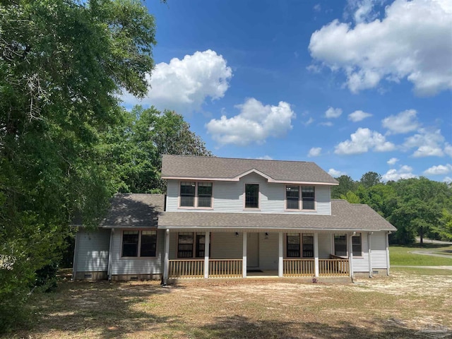 farmhouse featuring covered porch, a shingled roof, and crawl space