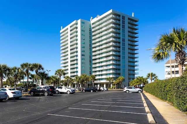 view of property featuring uncovered parking