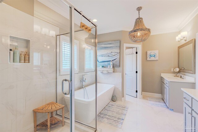bathroom featuring a freestanding tub, a shower stall, vanity, a notable chandelier, and ornamental molding