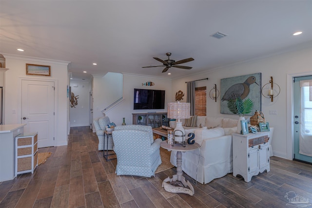 living room featuring a ceiling fan, visible vents, recessed lighting, and dark wood-type flooring