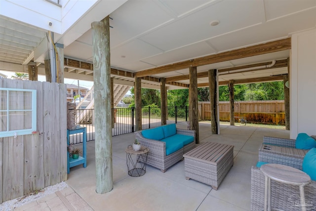view of patio / terrace featuring fence and outdoor lounge area