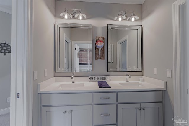 full bath with double vanity and a sink