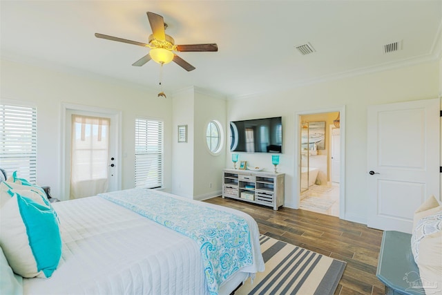 bedroom featuring crown molding, baseboards, dark wood finished floors, and visible vents