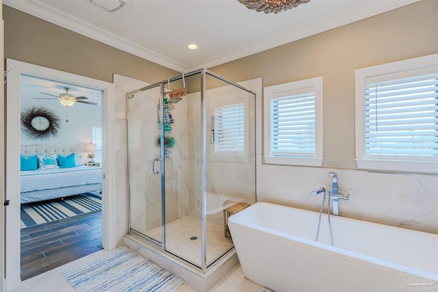 full bathroom with connected bathroom, crown molding, ceiling fan, a freestanding bath, and a shower stall