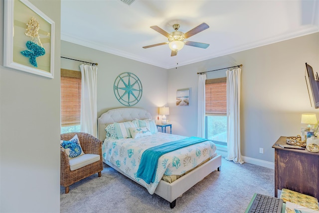 carpeted bedroom featuring crown molding, baseboards, access to exterior, and ceiling fan