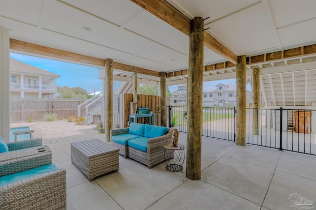 view of patio / terrace with stairs, fence, and an outdoor hangout area