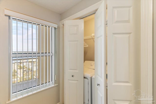 8499 Gulf Blvd Unit 1303, Navarre Beach, FL 32566 - laundry room featuring plenty of natural light and washer / clothes dryer