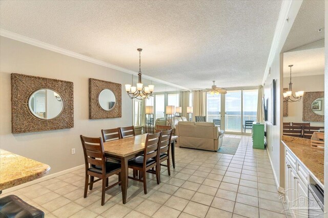 8499 Gulf Blvd Unit 1303, Navarre Beach, FL 32566 - dining room featuring a chandelier, crown molding, light tile patterned floors, baseboards, and a textured ceiling