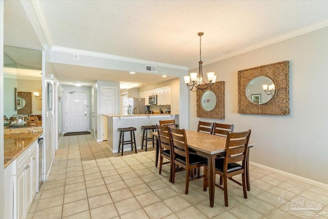 8499 Gulf Blvd Unit 1303, Navarre Beach, FL 32566 - dining room featuring light tile patterned floors, a chandelier, crown molding, a textured ceiling, and baseboards