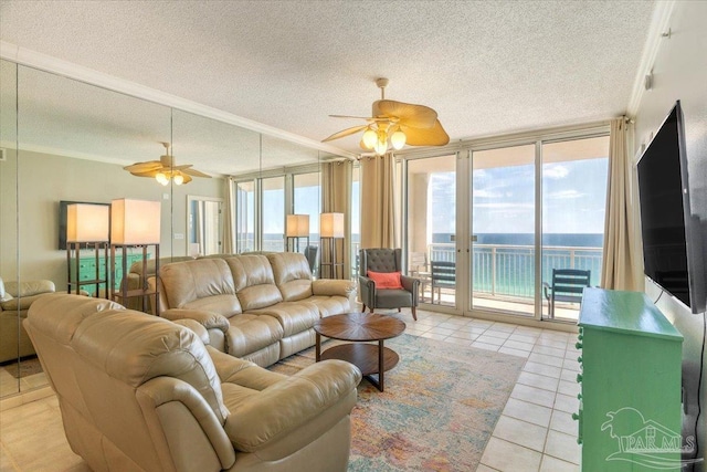 8499 Gulf Blvd Unit 1303, Navarre Beach, FL 32566 - living area with ceiling fan, expansive windows, light tile patterned flooring, and a textured ceiling