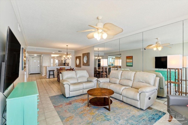 8499 Gulf Blvd Unit 1303, Navarre Beach, FL 32566 - living room featuring a ceiling fan, a chandelier, ornamental molding, a textured ceiling, and light tile patterned floors