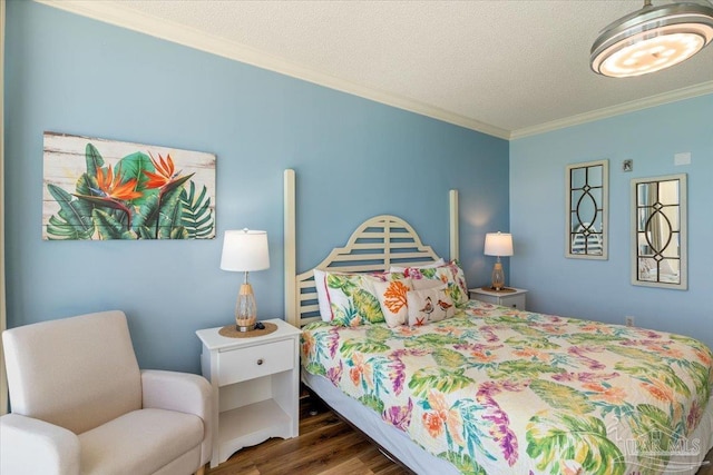 8499 Gulf Blvd Unit 1303, Navarre Beach, FL 32566 - bedroom featuring crown molding, wood finished floors, and a textured ceiling