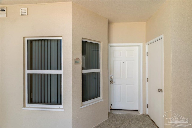 8499 Gulf Blvd Unit 1303, Navarre Beach, FL 32566 - property entrance with stucco siding