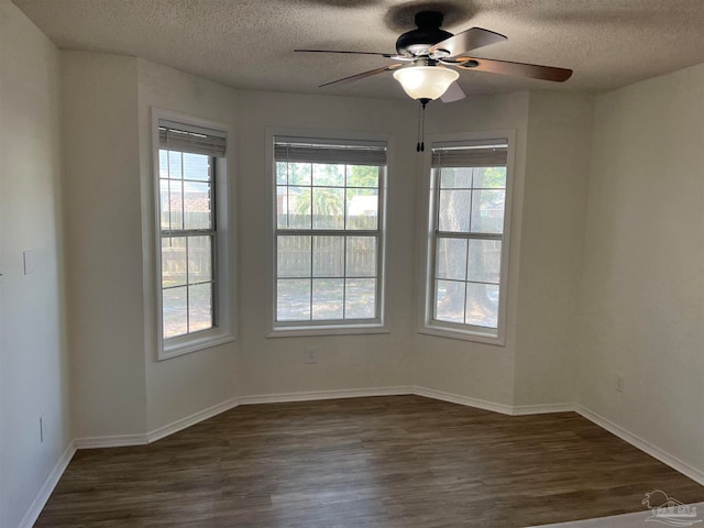 empty room featuring a textured ceiling, ceiling fan, and hardwood / wood-style floors