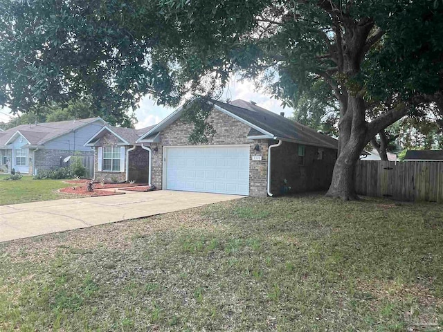 ranch-style home featuring a garage and a front yard