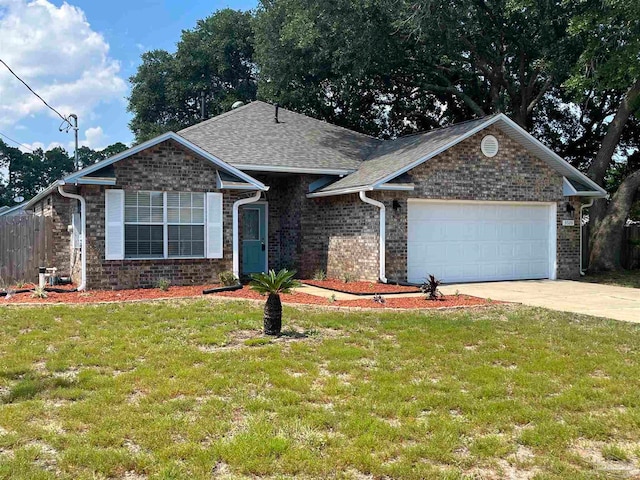 view of front facade with a garage and a front lawn