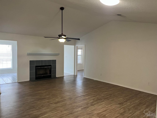 unfurnished living room with wood-type flooring, vaulted ceiling, and ceiling fan