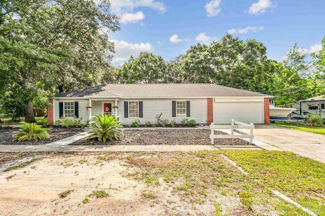 3608 George Ln, Navarre, FL 32566 - ranch-style home featuring concrete driveway, an attached garage, and brick siding